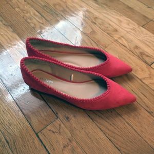 Bright red suede pom pom pointed toe flats